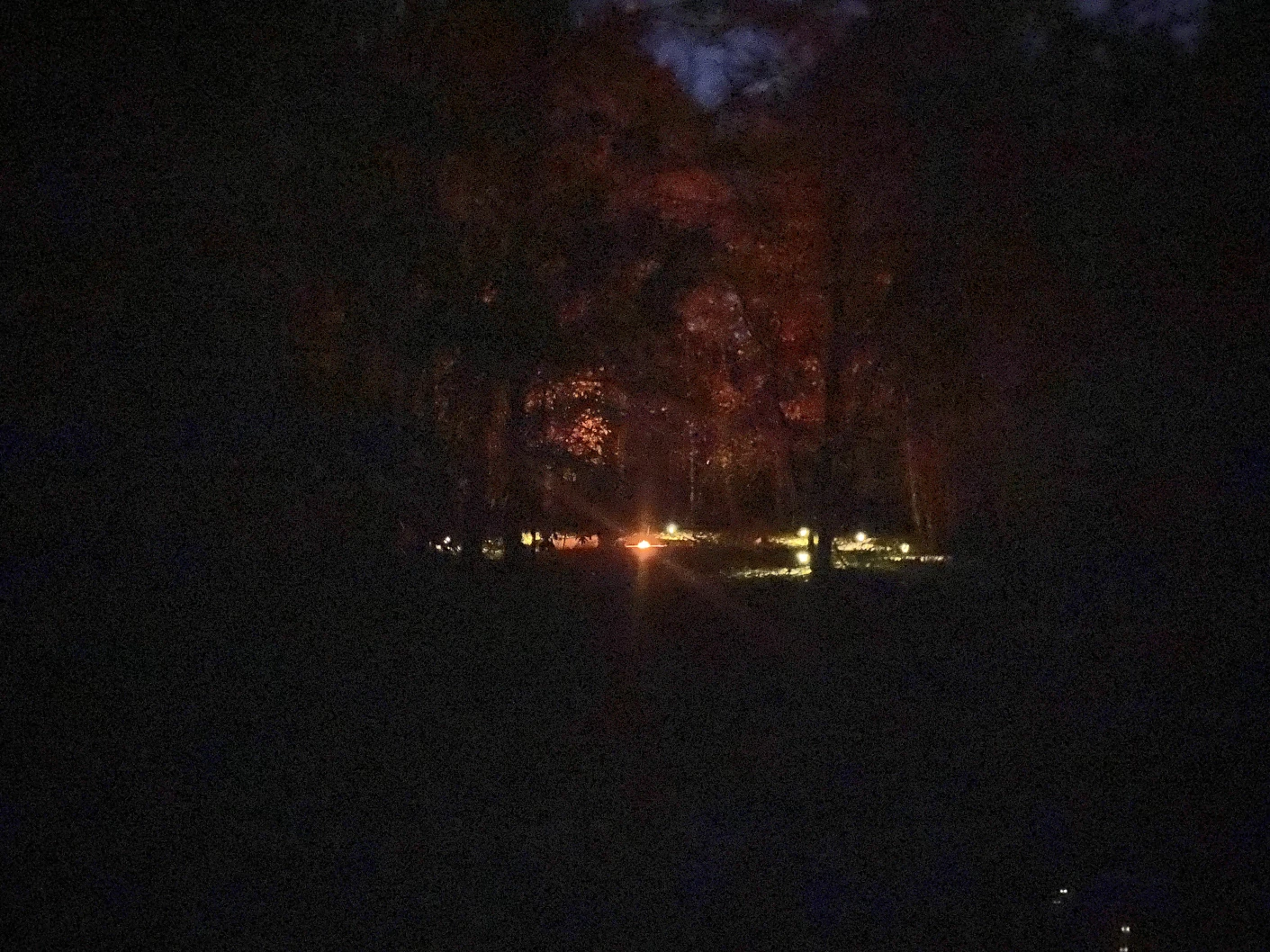 Campfire circle at night from a distance