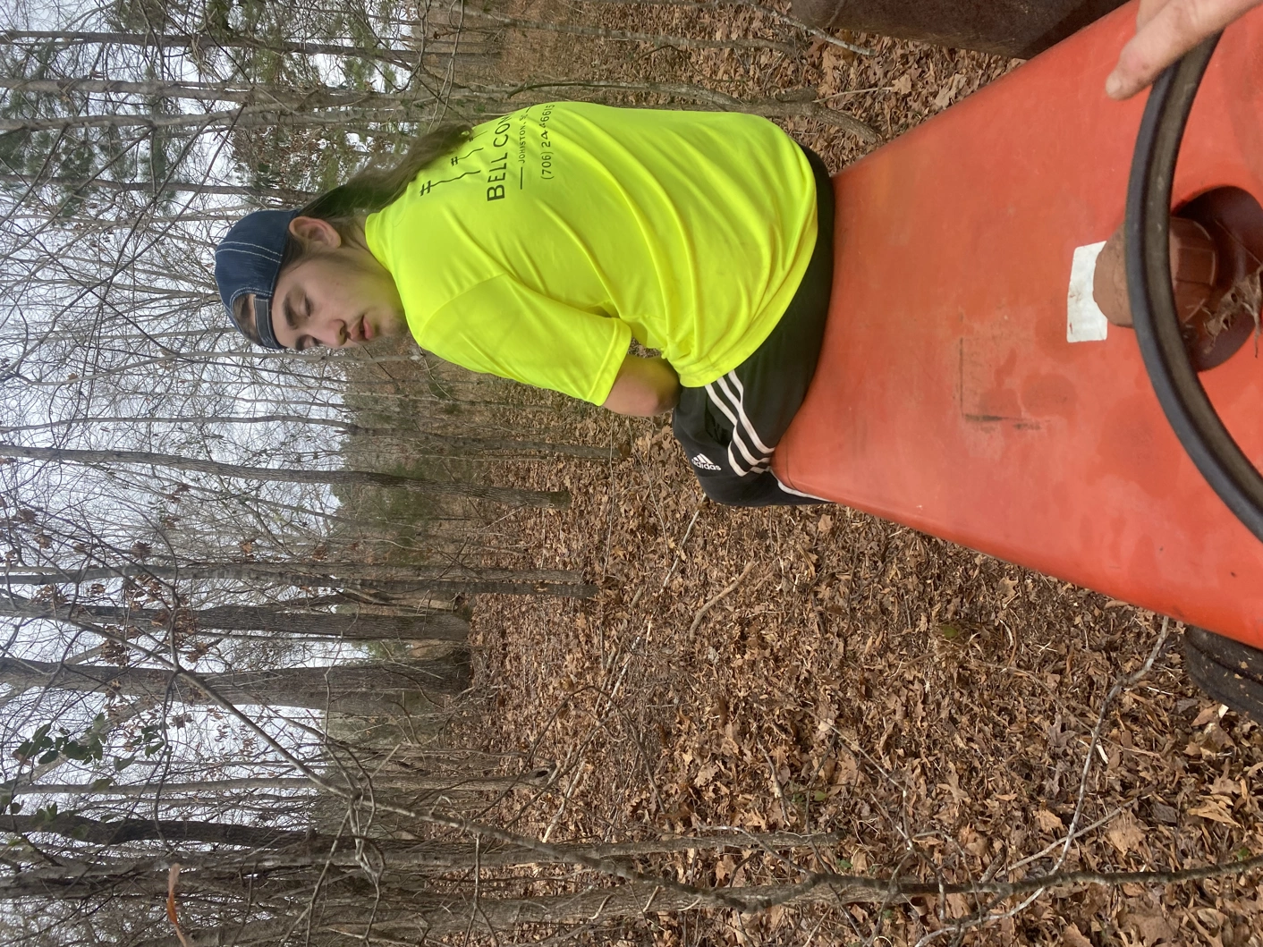 One person sitting on hood of a tractor